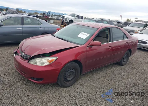 2004 Toyota Camry Le z USA, uszkodzony, nr VIN JTDBE32K340255550